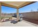 Covered patio with built-in grill and grassy area at 19371 N Nocera Rd, Maricopa, AZ 85138