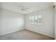 Bright bedroom with ceiling fan and window shutters at 19619 N Signal Butte Cir, Sun City, AZ 85373