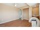 Bedroom with wood flooring and access to bath at 19619 N Signal Butte Cir, Sun City, AZ 85373