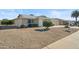 House with gravel landscaping and a two-car garage at 19619 N Signal Butte Cir, Sun City, AZ 85373