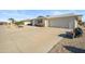 View of the home's front and driveway at 19619 N Signal Butte Cir, Sun City, AZ 85373