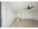 Bright living room with tile floors and ceiling fan at 19619 N Signal Butte Cir, Sun City, AZ 85373