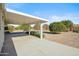 Covered patio with view of backyard landscaping at 19619 N Signal Butte Cir, Sun City, AZ 85373