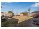 Large backyard with open space, shed, and wooden bench at 2041 N 23Rd St, Phoenix, AZ 85006