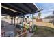 Covered patio with hanging planters and backyard view at 2041 N 23Rd St, Phoenix, AZ 85006