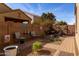 Cozy backyard patio with seating area and plants at 21081 E Via De Olivos --, Queen Creek, AZ 85142