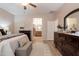 Main bathroom with walk-in shower, double vanity, and wood cabinets at 21081 E Via De Olivos --, Queen Creek, AZ 85142