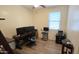 This bedroom features wood-look floors, a ceiling fan, and plenty of room for a home office at 21081 E Via De Olivos --, Queen Creek, AZ 85142