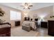 Main bedroom with a ceiling fan and large windows at 21081 E Via De Olivos --, Queen Creek, AZ 85142