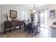 Dining area with wood table and chairs near a sliding glass door at 21081 E Via De Olivos --, Queen Creek, AZ 85142