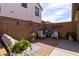 Cozy patio with brick flooring, seating, and small plants at 21081 E Via De Olivos --, Queen Creek, AZ 85142