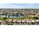 Aerial view of homes near a lake and golf course at 21964 N 59Th Ln, Glendale, AZ 85310