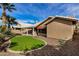 Landscaped backyard with putting green and a view of the house at 21964 N 59Th Ln, Glendale, AZ 85310