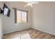 Bedroom with tile floors, ceiling fan, and window coverings at 21964 N 59Th Ln, Glendale, AZ 85310