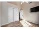 Bedroom with tile floors, double doors, and a TV mount at 21964 N 59Th Ln, Glendale, AZ 85310