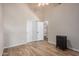 Bedroom with tile floors, double doors, and a small cabinet at 21964 N 59Th Ln, Glendale, AZ 85310