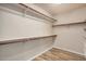 Spacious walk-in closet with ample shelving and hanging rods at 21964 N 59Th Ln, Glendale, AZ 85310