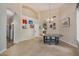 Elegant dining room featuring a large round table and high ceilings at 21964 N 59Th Ln, Glendale, AZ 85310