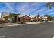 Houses on a tree-lined street at 21964 N 59Th Ln, Glendale, AZ 85310