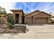 Tan two-story home with two car garage at 21964 N 59Th Ln, Glendale, AZ 85310