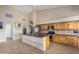 Modern kitchen with stainless steel appliances and wood cabinets at 21964 N 59Th Ln, Glendale, AZ 85310