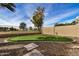 Private putting green in the backyard, perfect for golf enthusiasts at 21964 N 59Th Ln, Glendale, AZ 85310