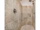 Large walk-in shower with tile surround and built-in seat at 21964 N 59Th Ln, Glendale, AZ 85310