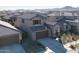 Two-story house with gray exterior and tile roof in a neighborhood at 23059 E Pummelos Rd, Queen Creek, AZ 85142