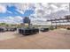 Outdoor fire pit area with seating and string lights at 23059 E Pummelos Rd, Queen Creek, AZ 85142