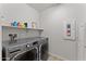 Laundry room with LG washer and dryer, and storage shelving at 23059 E Pummelos Rd, Queen Creek, AZ 85142