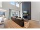 Spacious living room featuring a modern fireplace and high ceilings at 23059 E Pummelos Rd, Queen Creek, AZ 85142