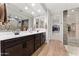 Modern bathroom with double vanity, large walk-in shower, and ample storage at 23059 E Pummelos Rd, Queen Creek, AZ 85142