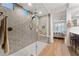 Large walk-in shower with hexagon tile and built-in bench at 23059 E Pummelos Rd, Queen Creek, AZ 85142