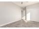 Bright bedroom featuring carpeted floor and double door closet at 24421 W Morning Vista Ln, Wittmann, AZ 85361