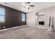 Spacious bedroom with ceiling fan, neutral wall colors, and carpet flooring at 24421 W Morning Vista Ln, Wittmann, AZ 85361