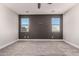 Spacious bedroom with ceiling fan, neutral wall colors, and carpet flooring at 24421 W Morning Vista Ln, Wittmann, AZ 85361