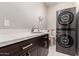 Laundry room with modern washer and dryer, and countertop at 24421 W Morning Vista Ln, Wittmann, AZ 85361