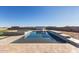 Modern rectangular pool with a spa, stone coping, and mountain views at 24421 W Morning Vista Ln, Wittmann, AZ 85361