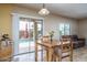 Casual dining area with sliding doors leading to a pool at 26133 W Yukon Dr, Buckeye, AZ 85396