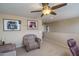 Spacious loft with comfortable seating and ceiling fan at 26133 W Yukon Dr, Buckeye, AZ 85396