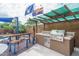 Outdoor kitchen with built-in grill, sink and countertop space at 26133 W Yukon Dr, Buckeye, AZ 85396