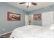 Comfortable bedroom with ceiling fan and access to another room at 29606 N Tatum Blvd # 161, Cave Creek, AZ 85331