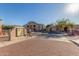 Gated community entrance with paved road and surrounding buildings at 29606 N Tatum Blvd # 161, Cave Creek, AZ 85331