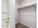 Bathroom with shower and shelving at 32014 N Redding St, Wittmann, AZ 85361