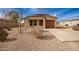 New construction home with desert landscaping and a brown garage door at 32014 N Redding St, Wittmann, AZ 85361