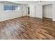 Bright bedroom with wood-look floors and a large closet at 3334 S Elm St, Tempe, AZ 85282