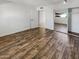 Light and airy bedroom with wood-look floors and mirrored closet at 3334 S Elm St, Tempe, AZ 85282