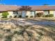 Front view of condo with brown tile roof and red flowers at 3334 S Elm St, Tempe, AZ 85282