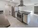 Modern kitchen with stainless steel appliances and an island at 3334 S Elm St, Tempe, AZ 85282