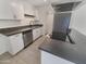 Modern kitchen with stainless steel appliances and dark countertops at 3334 S Elm St, Tempe, AZ 85282